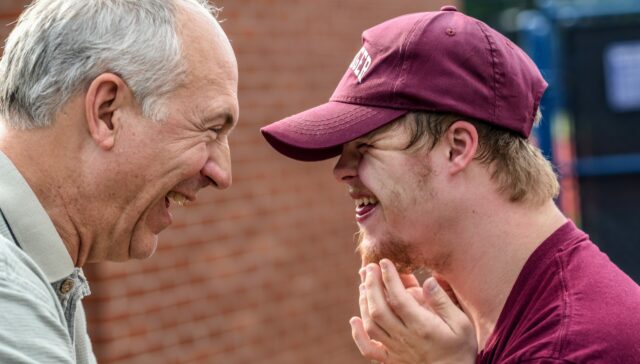 Father and son laughing together