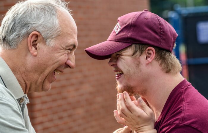 Father and son laughing together