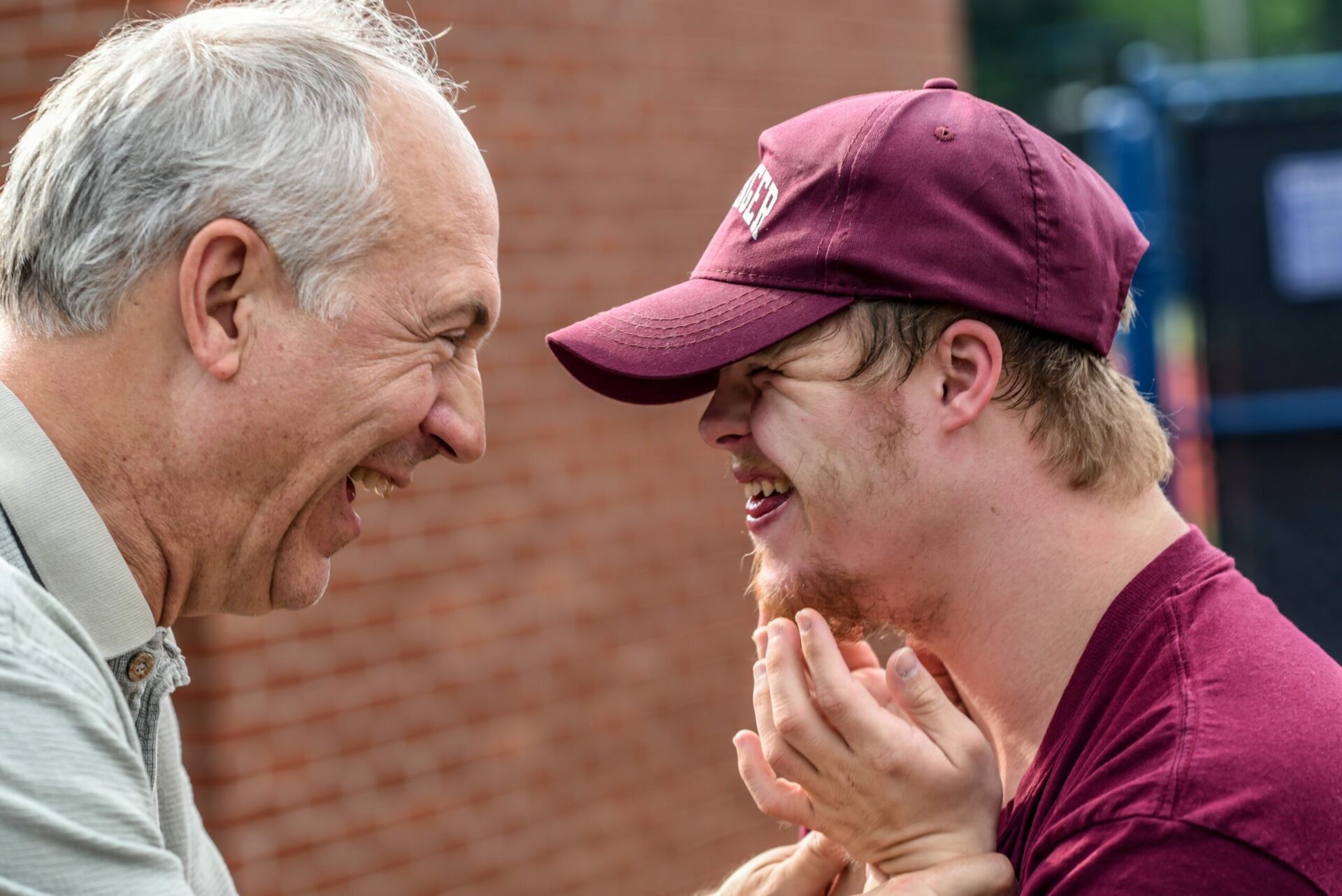Father and son laughing together