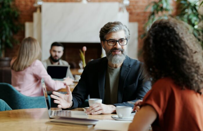Room of various business people who are discussing business