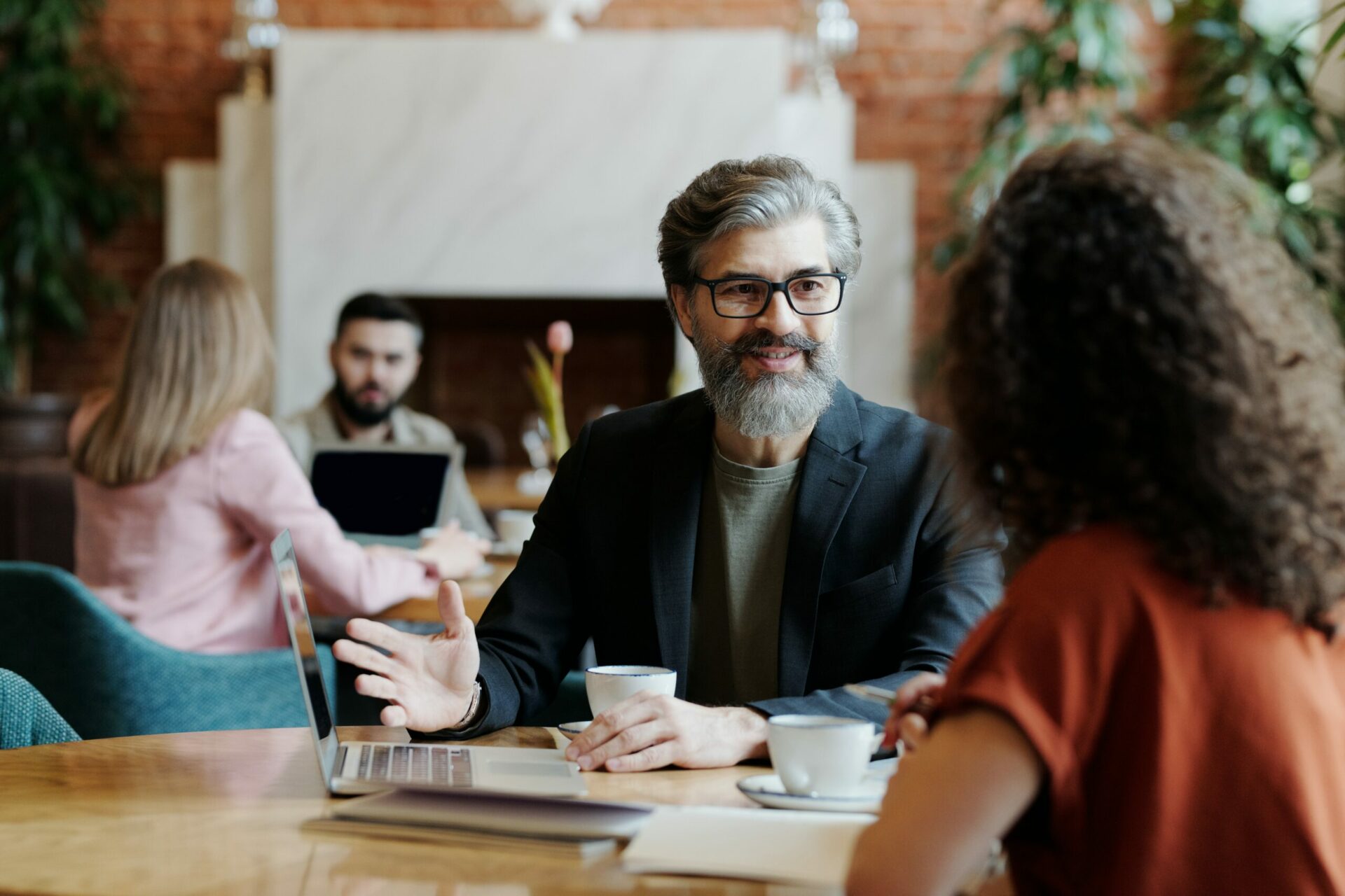Room of various business people who are discussing business