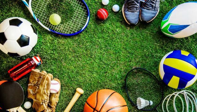 A group of sports equipment arranged on the grass.