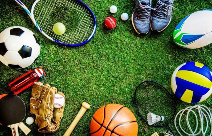 A group of sports equipment arranged on the grass.