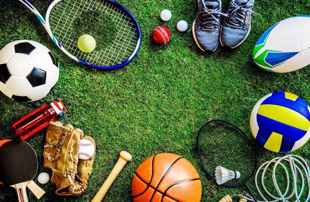 A group of sports equipment arranged on the grass.