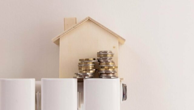 A house with coins on top of a radiator.