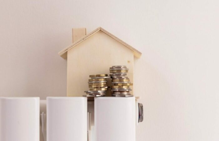 A house with coins on top of a radiator.