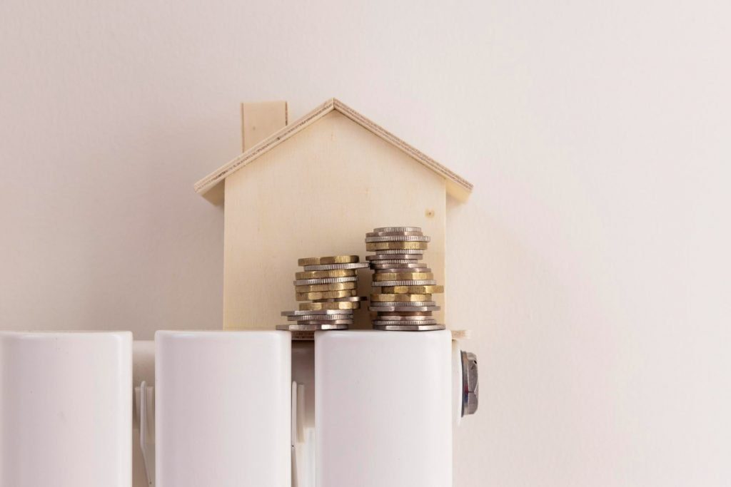 A house with coins on top of a radiator.