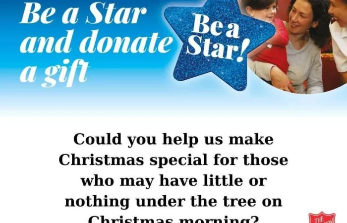 Picture: A smiling family. Text: Be a Star and donate a gift. Coul dyou help us make Christmas special for those who may have little or nothing under the tree on Christmas morning?