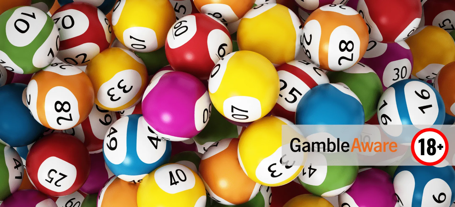 A lot of lottery balls. In the bottom-right corner is the 'GambleAware logo, and the 18+ only logo
