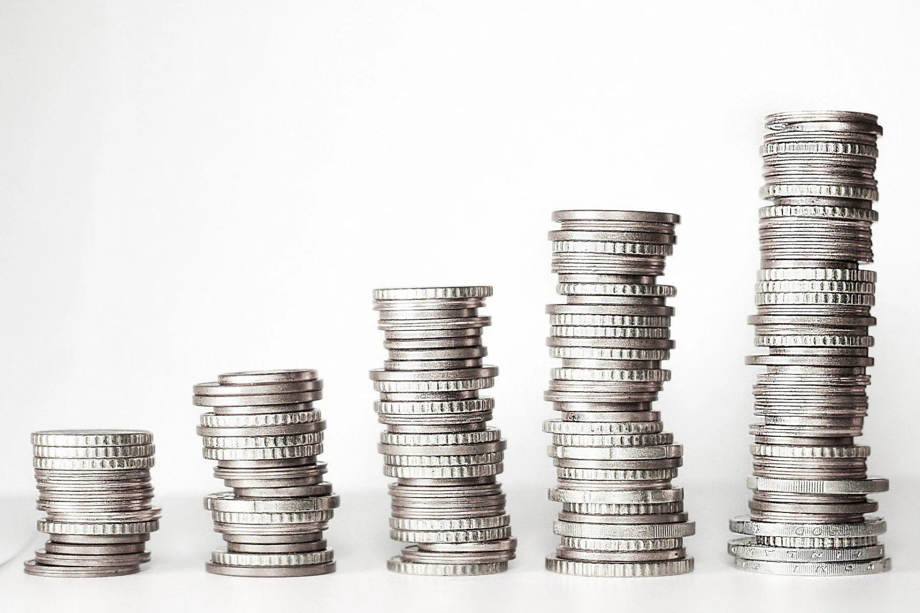 Stacks of coins, going bigger from left to right