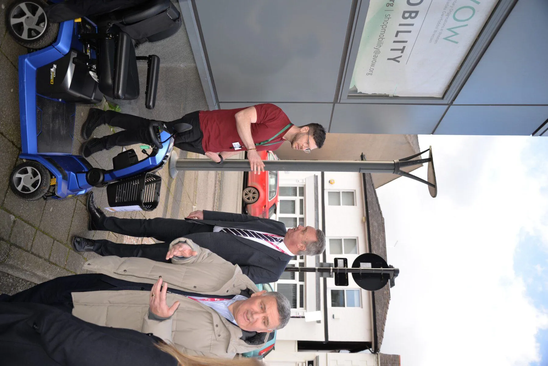 Visit of Cllrs Nigel Williams and Mark Pritchard - Outside with a Scooter Visit of Cllrs Nigel Williams and Mark Pritchard - Outside with a Scooter