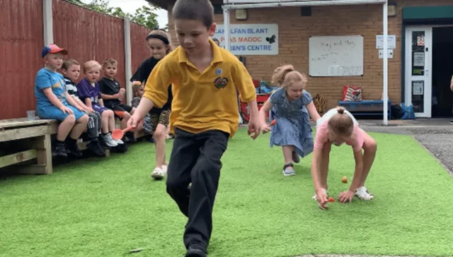 Little Sunflowers - Boy running Egg And Spoon Race