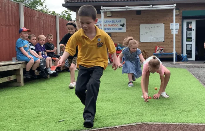 Little Sunflowers - Boy running Egg And Spoon Race