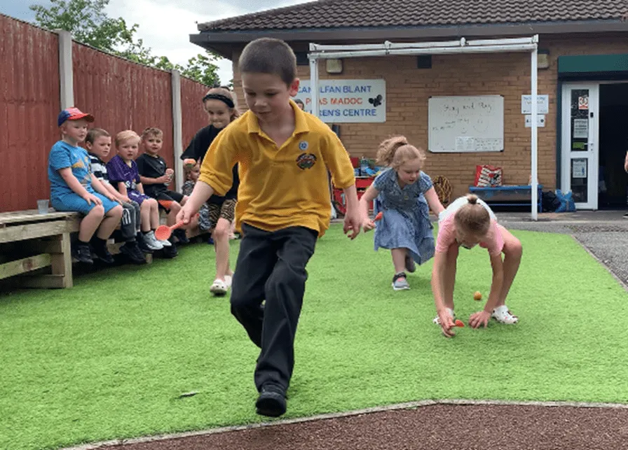 Little Sunflowers - Boy running Egg And Spoon Race