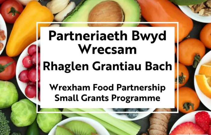 Partneriaeth Bwyd Wrecsam / Wrexham Food Partnership Rhaglen Grantiau Bach / Small Grants Programme Text on a background of fruits and nuts.