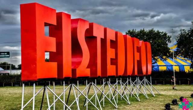 Eisteddfod Sign against a cloudy-grey sign