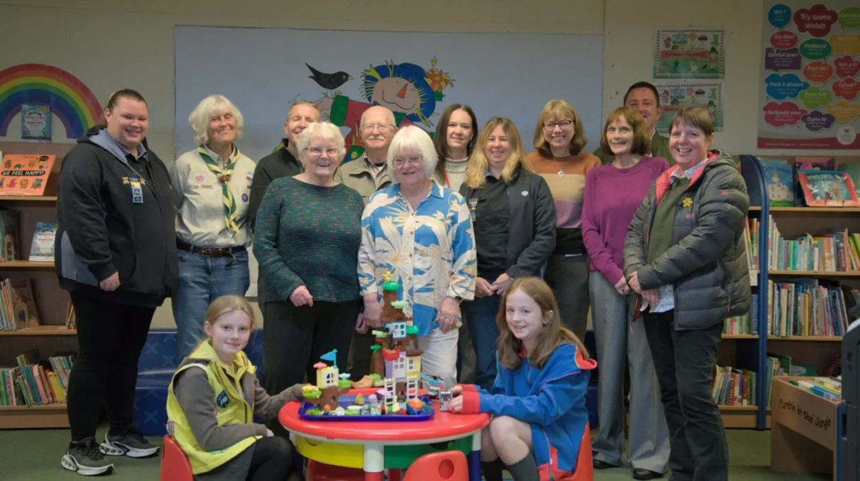 A group photo of all recipients of the money. 1st Moss Scouts (Sue Mort), Friends of Moss Valley, The Rainbow Foundation (Claire Partridge and Ian Pope), Brynteg Library, AVOW (Jo Young), 1st Brynteg Guides Rainbows and Brownies (Catriona Kempster) and members of the retiring members of the Broughton Community CIC (Eva Thomspon and Irene Jones).