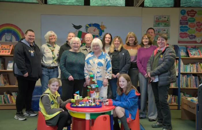 A group photo of all recipients of the money. 1st Moss Scouts (Sue Mort), Friends of Moss Valley, The Rainbow Foundation (Claire Partridge and Ian Pope), Brynteg Library, AVOW (Jo Young), 1st Brynteg Guides Rainbows and Brownies (Catriona Kempster) and members of the retiring members of the Broughton Community CIC (Eva Thomspon and Irene Jones).