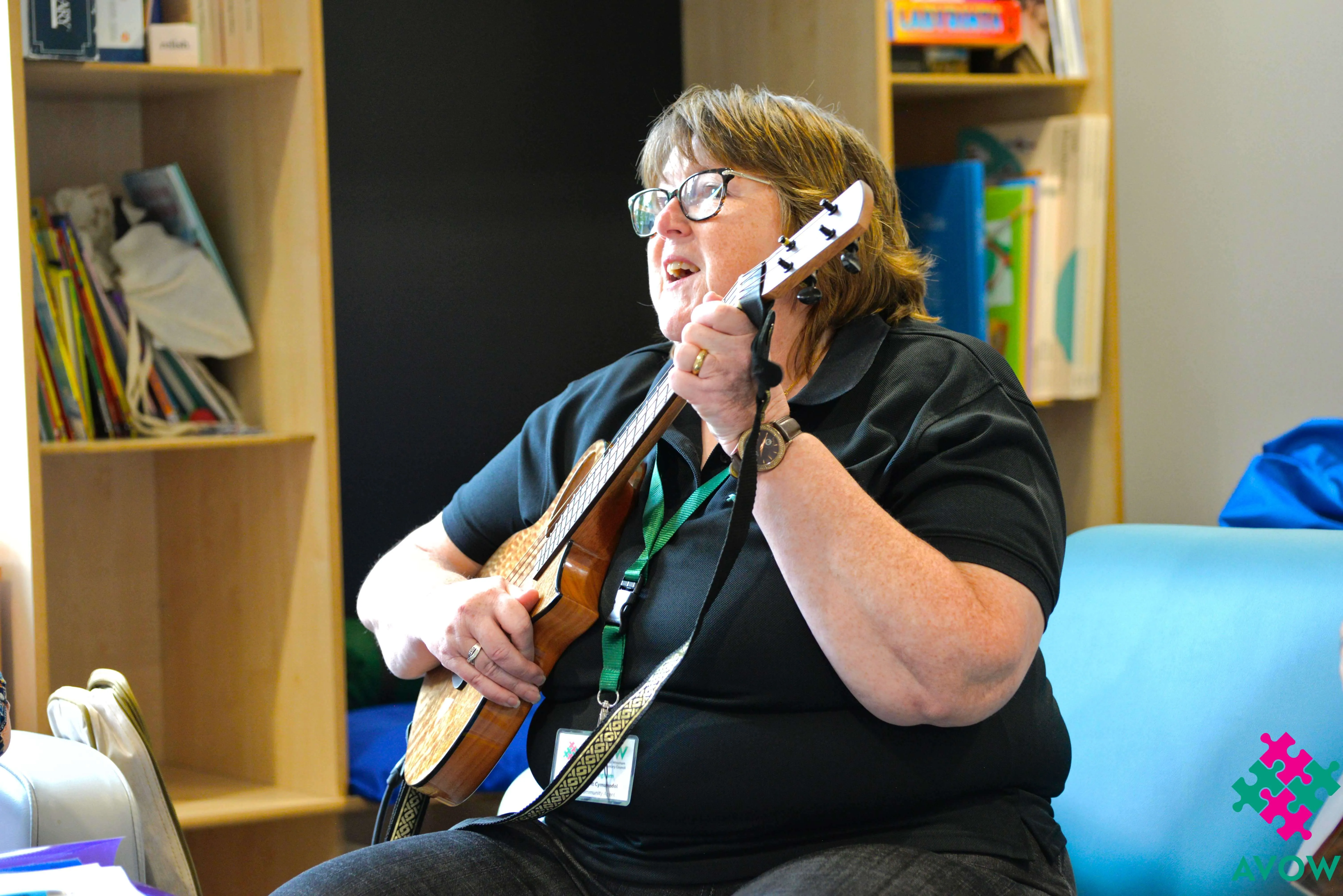 Community Agent Angie playing a Ukulele Community Agent Angie playing a Ukulele