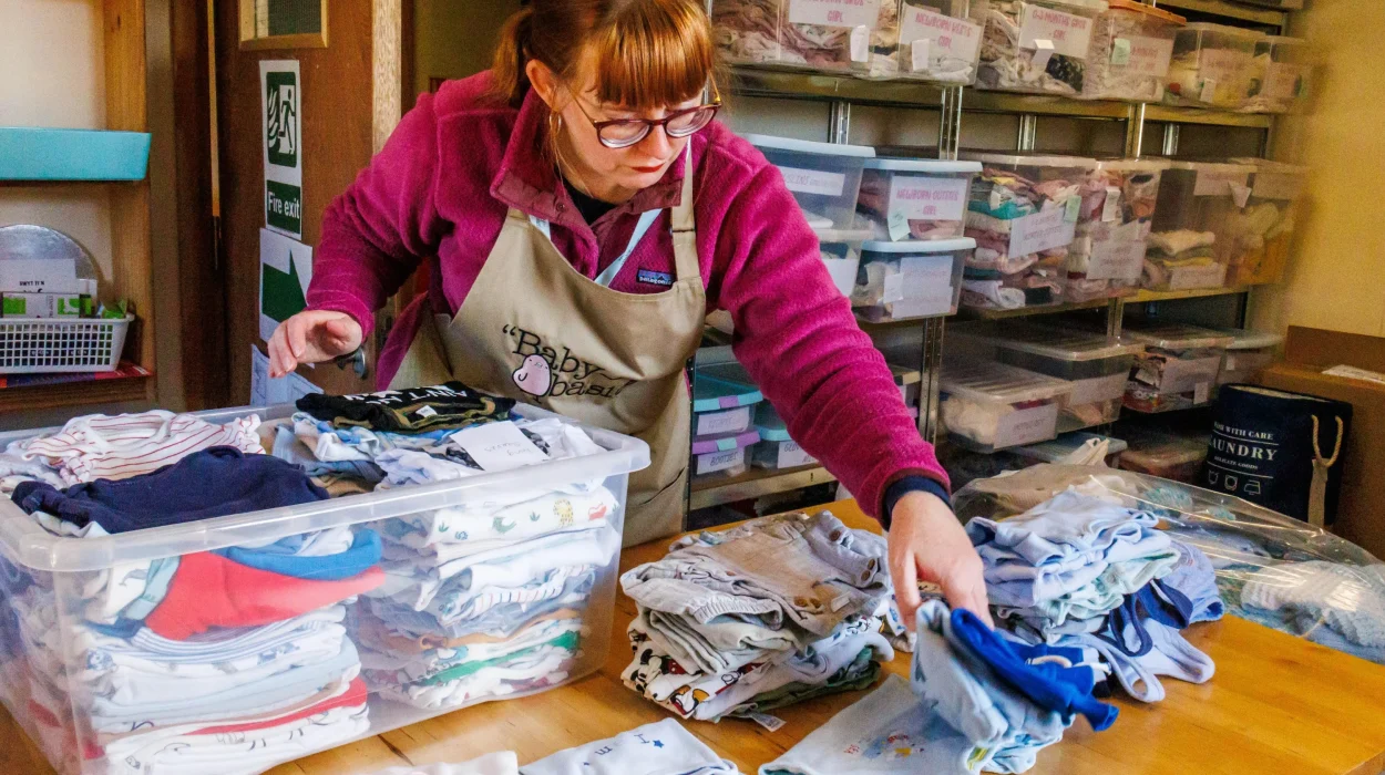 Baby Basics: Women sorting clothes.